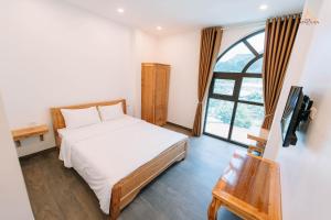 Voodi või voodid majutusasutuse Epic Đồng Văn Hotel toas