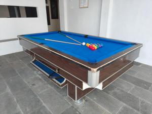 a pool table with a cue on top of it at Villa Estate 43 New in Batu