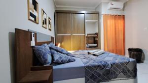 Ένα ή περισσότερα κρεβάτια σε δωμάτιο στο Casa ampla e agradável com piscina e churrasqueira