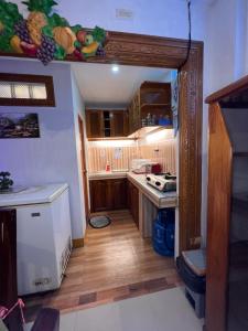 Kuchyň nebo kuchyňský kout v ubytování JMCL RESIDENCES + 23 fotografií