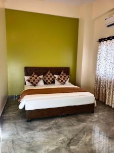 Postel nebo postele na pokoji v ubytování Hotel Sai 9 Heaven