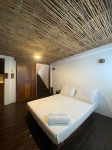 מיטה או מיטות בחדר ב-Boracay Coco Huts