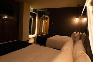 Postel nebo postele na pokoji v ubytování Hotel Yoru