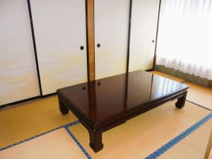 a coffee table is sitting in a room at Yado Ajimu - Vacation STAY 35712v in Manzawa