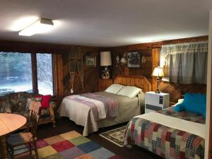 Postel nebo postele na pokoji v ubytování Moose twin cabin