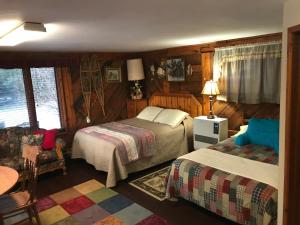 Postel nebo postele na pokoji v ubytování Moose twin cabin