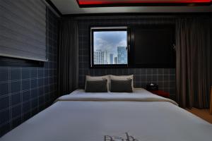 Postel nebo postele na pokoji v ubytování Hotel Danube Seomyeon