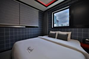 Postel nebo postele na pokoji v ubytování Hotel Danube Seomyeon