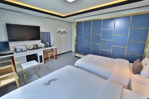 Postel nebo postele na pokoji v ubytování Hotel Danube Seomyeon