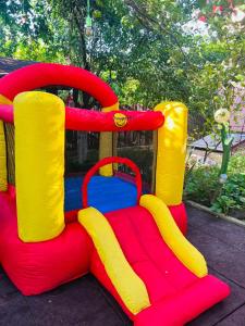 a inflatable bounce house with yellow rubber boots on it at IMPERIUM DK VILLA 