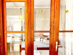 a door to a room with a living room at 4 Seasons apartments in Himare +74 photos