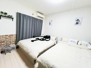 Postel nebo postele na pokoji v ubytování 大塚駅5分4人可