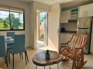 a kitchen and dining room with a table and chairs at High Tide 2 bed1 bath condo Terrace in Coco