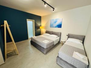 Postel nebo postele na pokoji v ubytování STAY-FIVE rooms & apartments