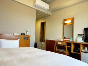 Postel nebo postele na pokoji v ubytování Hotel Route-Inn Chiryu -Kokudou 1 Gou-