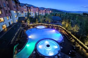 a swimming pool in the middle of a building at The Steamboat Grand in Steamboat Springs