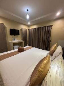 Ένα ή περισσότερα κρεβάτια σε δωμάτιο στο Serene Lanta Resort