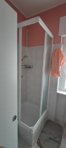 a shower with a glass door in a bathroom at Shangri-la in Civate