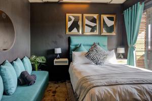 a bedroom with a bed with a blue head board at Premium Stay in Central Johannesburg Cultural Heart - Hallmark House in Johannesburg