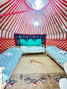 Postel nebo postele na pokoji v ubytování Eco Resort Kaiyrma