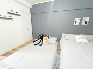Postel nebo postele na pokoji v ubytování 高田馬場4分 最大7人 02