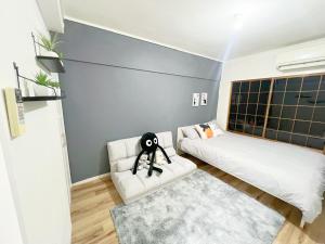 Postel nebo postele na pokoji v ubytování 高田馬場4分 最大7人 02