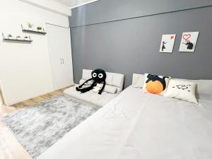 Postel nebo postele na pokoji v ubytování 高田馬場4分 最大7人 02