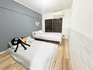 Postel nebo postele na pokoji v ubytování 高田馬場4分 最大7人 02