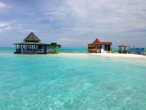 a group of buildings on a beach in the water at Apartamento Edificio Bahia Fragata in San Andrés