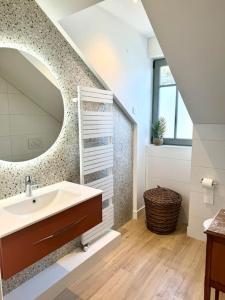 a bathroom with a sink and a mirror at Face Mer Villa Le Ker Breton in Pornichet +61 photos