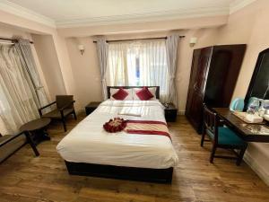 Rúm í herbergi á Hotel Liv Inn