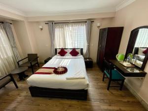 Rúm í herbergi á Hotel Liv Inn