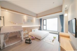 Postel nebo postele na pokoji v ubytování Hotel Liyaou