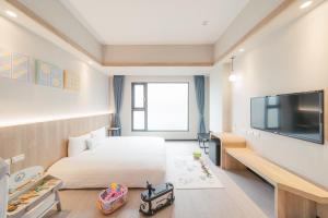 TV a/nebo společenská místnost v ubytování Hotel Liyaou