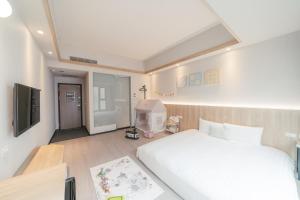 Postel nebo postele na pokoji v ubytování Hotel Liyaou
