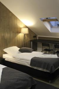 
Кровать или кровати в номере Отель PEOPLE Лофт Тверская
