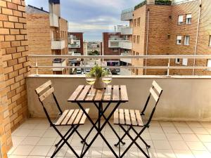 a table and two chairs sitting on a balcony at Apartments Atlantis by UR in Vila Nova de Gaia