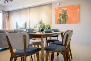 a dining room with a table and chairs at Tropicana 218 Spacious Luxury City 3BedRoom 3 Car park 11pax in George Town