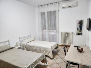 Postel nebo postele na pokoji v ubytování Elisa Adda House