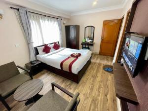 Rúm í herbergi á Hotel Liv Inn