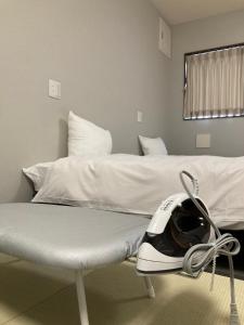 Vuode tai vuoteita majoituspaikassa KYU KYU HOTEL