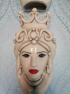 a statue of a woman with a crown on her head at Lazy Olives in Tongeren