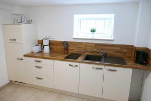 Kuchyň nebo kuchyňský kout v ubytování Ferienwohnung Heimchen