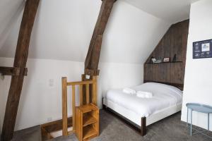 a small bedroom with a bed and a ladder at Le Petit Mont by Cocoonr in Rennes