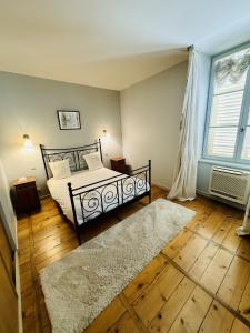 Postel nebo postele na pokoji v ubytování La Maison Félix, du Domaine Yvon Félix Clerget - Centre de Pommard