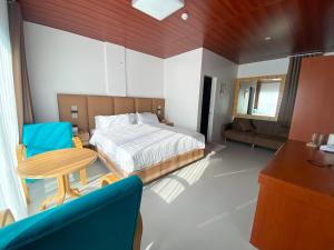 Postel nebo postele na pokoji v ubytování Q Beach Resort + 34 fotografií