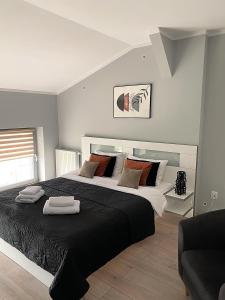 Posteľ alebo postele v izbe v ubytovaní H-T-L Apartamenty Junior