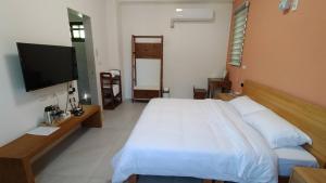 TV a/nebo společenská místnost v ubytování Liangchen B&B + 10 fotografií