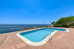 a swimming pool with a view of the ocean at Ático Crucero Suite VIP in Roses +72 photos