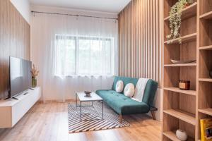 Et tv og/eller underholdning på Patronka Apartments - Stylish apartment with a divided sleeping area